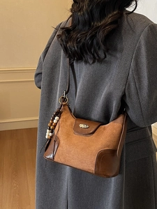 Vintage dark brown crossbody dumpling bag with suede splicing and unique wood bead charm