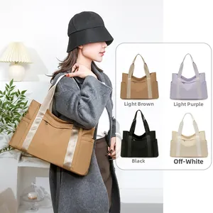 Detail showing high-capacity nylon tote bags in light brown, purple, black, and off-white
