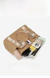 Top view of large capacity khaki nylon tote bag showing camera and tablet storage