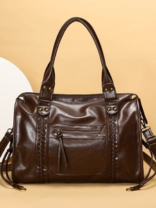 Grande borsa tote retrò marrone scuro con dettagli in frange e tracolla regolabile