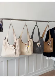 Selection of canvas tote bags in four colors with embroidery and plush dog charms