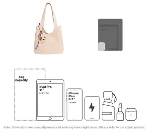 Capacity diagram of beige canvas tote showing storage for iPad, phone and accessories