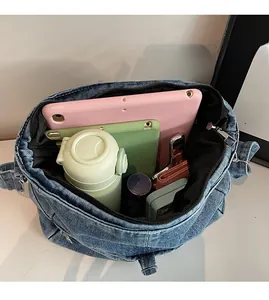Top view of spacious denim tote bag showing interior storage capacity and black lining