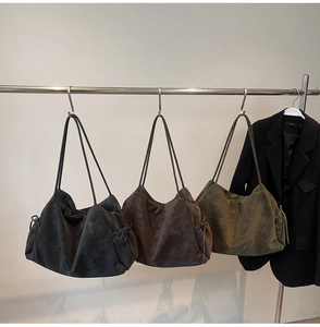 Detailed view of large vintage tote bags in black, coffee, and olive green soft suede