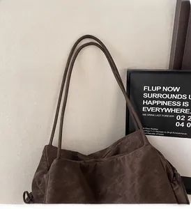 Detail of vintage coffee tote bag with matte texture and durable double shoulder straps