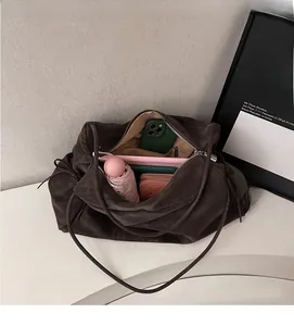 Interior layout of large dark brown leather tote bag showing high storage capacity