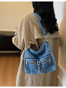 Vintage blue washed denim hobo bag for women with silver zippers and adjustable strap