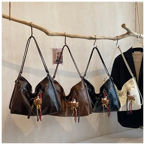 Detailed set of four PU leather tote bags in various colors featuring cute bear pendants