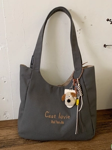 Vintage dark gray canvas shoulder bag with C'est la vie embroidery and plush charm