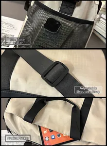 Detail view of adjustable strap, side mesh pocket, and front storage on beige travel bag