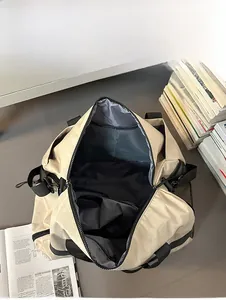 Macro view of spacious interior with mesh pockets in the beige travel bag