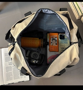 Top-down view of travel bag interior with mesh zipper pocket and spacious storage