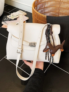 Off-white lychee grain leather tote bag with dachshund charm and silver twist lock