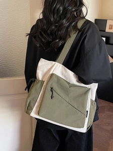 Fashionable contrast color nylon tote bag with front zipper pocket and side drawstring