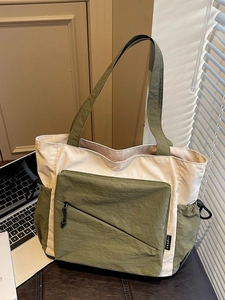 Large cream and olive green canvas tote bag with contrast pocket and dual shoulder straps