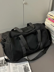 Black large capacity travel bag with shoulder strap and reinforced handles for fitness