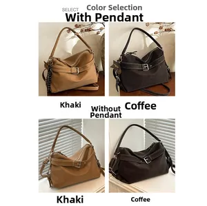Detailed close-up of khaki and coffee tote bags with star pendants on wooden desk