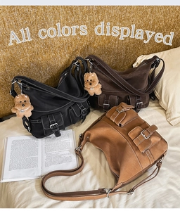 Detailed display of multi-pocket utilitarian tote bags in black, dark brown, and light brown