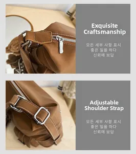 Detail of brown leather tote featuring adjustable strap and silver metal hardware accents