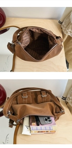 Detail view of large capacity vintage brown shoulder bag showing organized interior storage