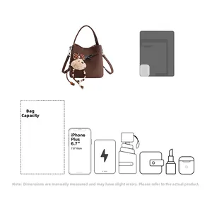 Brown lychee leather bucket bag detail showing internal capacity for phone and essentials