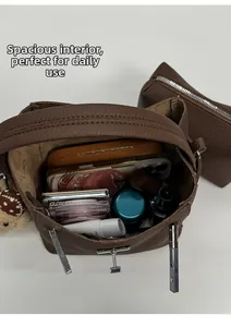 Interior view showing the large capacity of the brown lychee pattern bucket bag