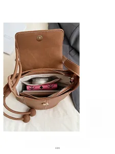 Interior view showing the large storage capacity of this brown leather shoulder bag