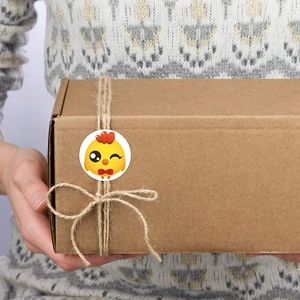 Happy Easter chicken sticker on brown kraft gift box with natural twine cord