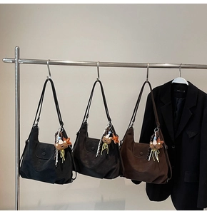 Three large matte tote bags in black, coffee and brown with bear charms and tassels