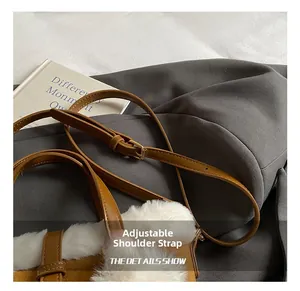 Close-up of adjustable leather strap with gold buckle on retro faux fur bucket bag