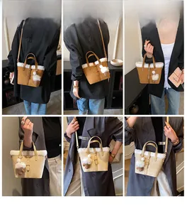 Detail view of model wearing a plush bucket bag with faux fur trim and cute charms