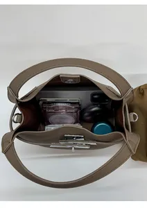 Internal view showing the spacious capacity of a brown vintage leather bucket bag