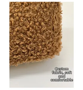 Close-up of premium brown teddy fabric showing soft texture and fluffy sherpa wool material