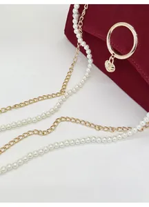 Burgundy velvet bridal handbag with shell pendant, pearl chain and metal strap detail