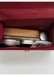 Internal view of the red crossbody bag showing capacity for phone and cosmetics