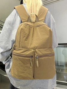 Khaki minimalist nylon travel backpack with large capacity and dual front zipper pockets
