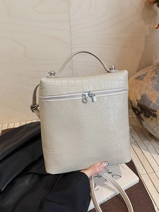 Chic beige crocodile texture tote bag with silver hardware and adjustable strap