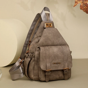 Detail of vintage brown soft leather chest bag with gold twist lock and JINGPIN logo