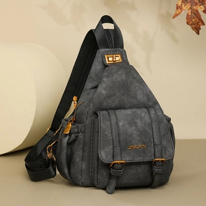 Macro detail of retro gray soft leather bag with golden metal twist lock and buckle