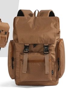 Brown checkered backpack with large capacity and multi-pocket design for travel