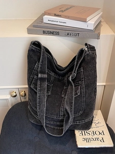 Retro washed denim tote bag with dual front pockets and contrast stitching detail