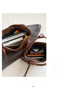 Interior view of brown leather tote bags showing large capacity and internal compartments