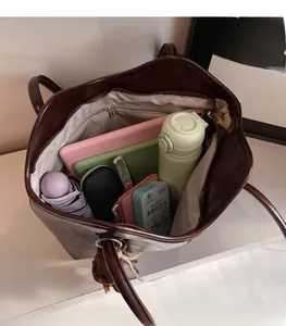 Top view of large brown tote bag interior showing ample space for daily essentials