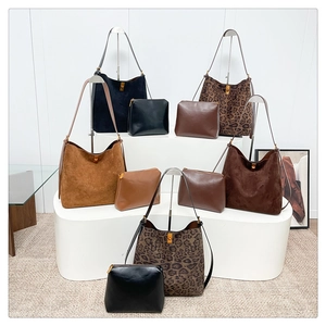 Detailed set of suede tote bags and leopard print pouches in assorted autumn colors