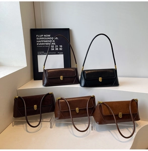 Detailed collection of vintage faux leather baguette bags in dark brown and black finishes