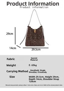 Close-up of leopard print tote bag with gold twist lock and adjustable shoulder strap