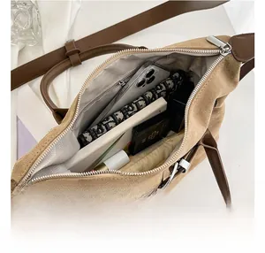 Top view of large suede tote bag showing spacious interior with daily essentials