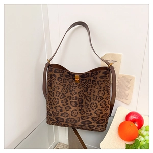 Detail of leopard print hobo bag with gold twist lock and premium leather strap