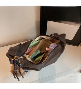 Spacious interior of charcoal grey shoulder bag showing large capacity for essentials