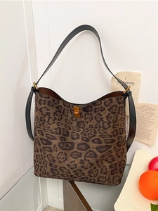 Fashionable leopard print hobo tote bag with black leather strap and gold clasp